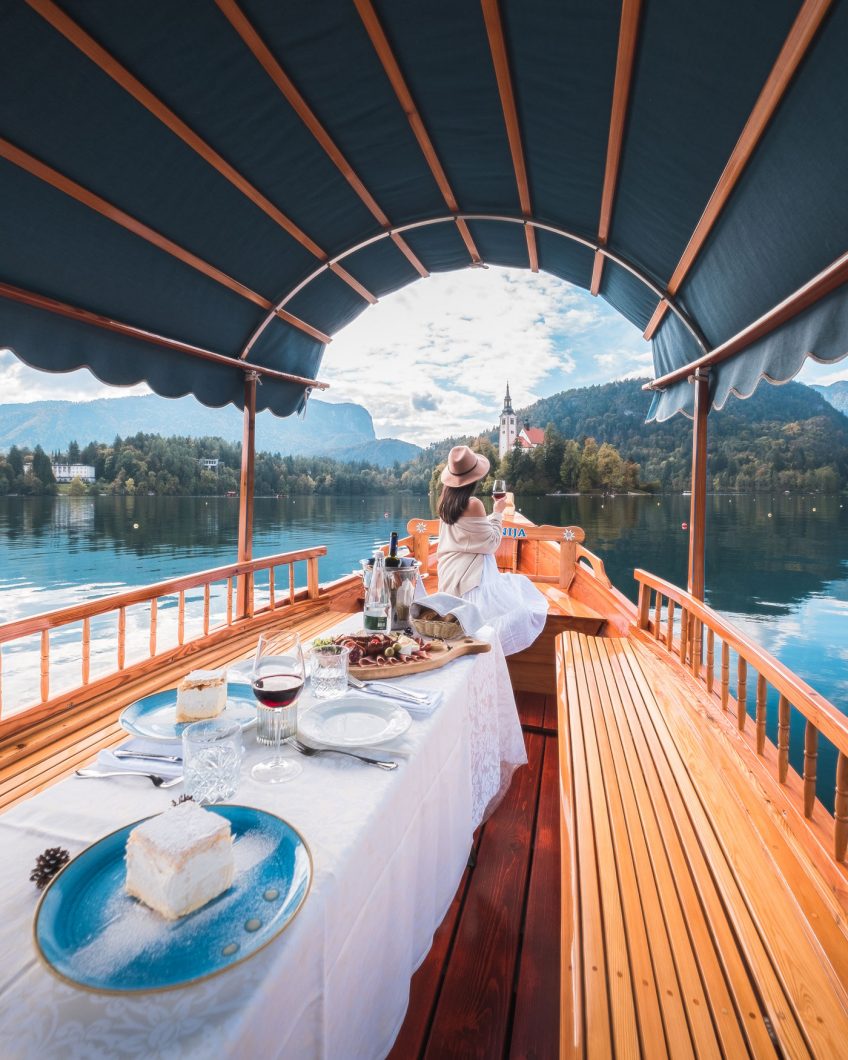 Girl enjoying Boat Lunch on Lake Bled